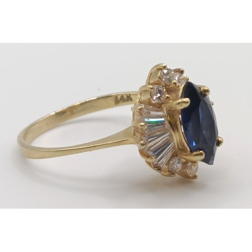 413 - A 9ct gold, blue and white stone cluster ring