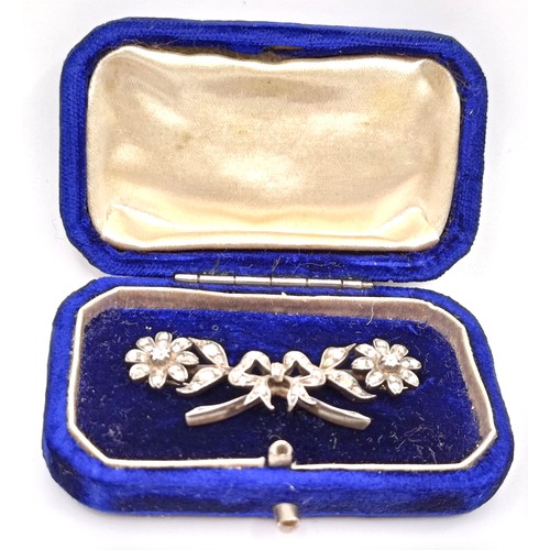 417 - A late 19th/early 20th century diamond floral brooch, in a vintage jewellery box