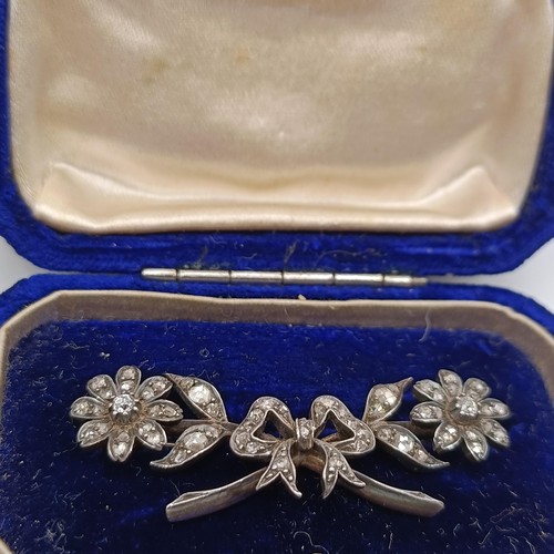 417 - A late 19th/early 20th century diamond floral brooch, in a vintage jewellery box