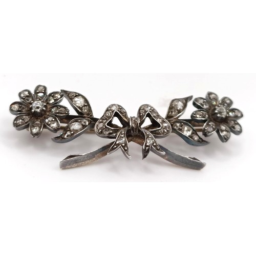 417 - A late 19th/early 20th century diamond floral brooch, in a vintage jewellery box