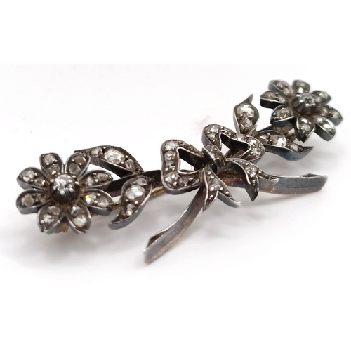 417 - A late 19th/early 20th century diamond floral brooch, in a vintage jewellery box