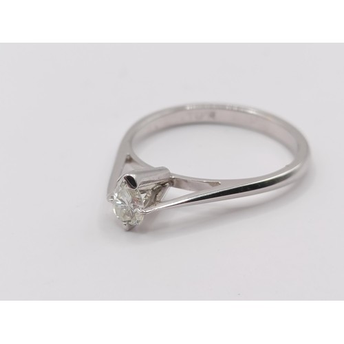 423 - A platinum and pear shaped diamond solitaire ring, ring size K