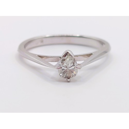 423 - A platinum and pear shaped diamond solitaire ring, ring size K