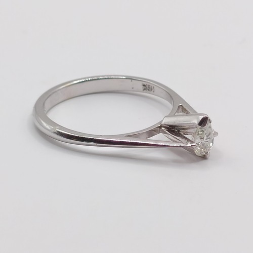 423 - A platinum and pear shaped diamond solitaire ring, ring size K