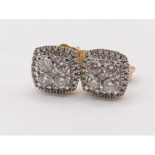 424 - A pair of 9ct gold and diamond ear studs