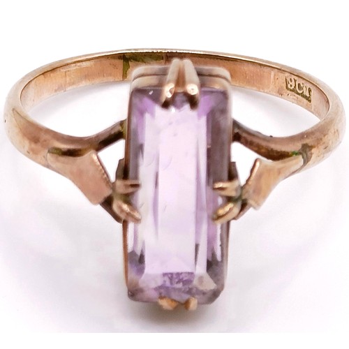 425 - A 9ct gold and pink stone baguette cut ring, ring size O