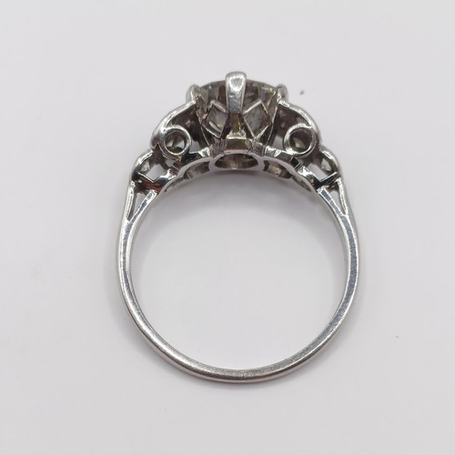 426 - A platinum and diamond ring, the central stone approx. 1.65ct, with further diamonds to the shoulder... 