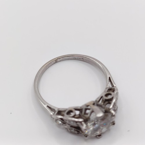 426 - A platinum and diamond ring, the central stone approx. 1.65ct, with further diamonds to the shoulder... 