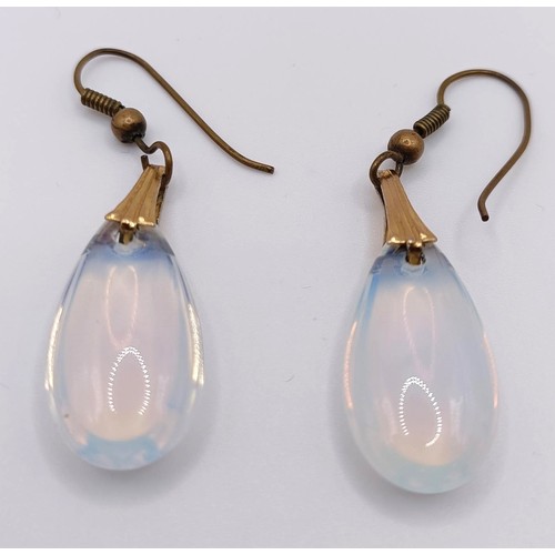 429 - A pair of yellow coloured metal and moonstone style drop earrings