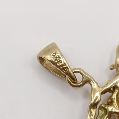 434 - A 9ct gold and diamond pendant, in the form of a dragon