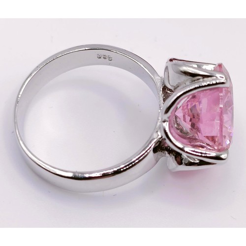 436 - A large man made pink gemstone, 30.6 g, two smaller, and a silver ring inset with a pink stone (4)