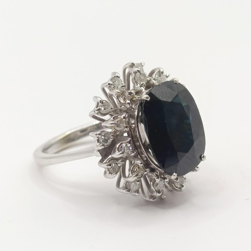 437 - An 18ct white gold, sapphire and diamond ring, ring size J