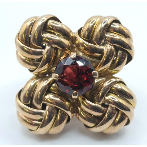 439 - A pair of yellow metal and garnet clip on earrings