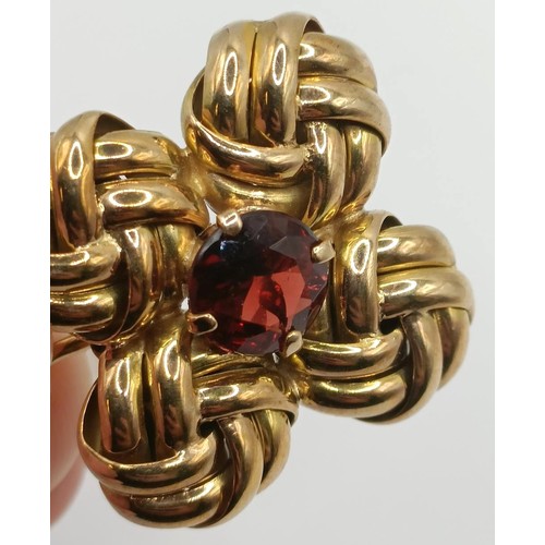 439 - A pair of yellow metal and garnet clip on earrings