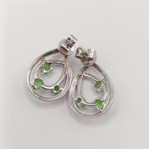 446 - A pair of 18ct gold, diamond and green stone earrings