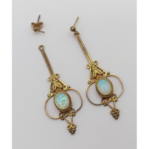 447 - A pair of Indian yellow coloured metal and opal drop earrings