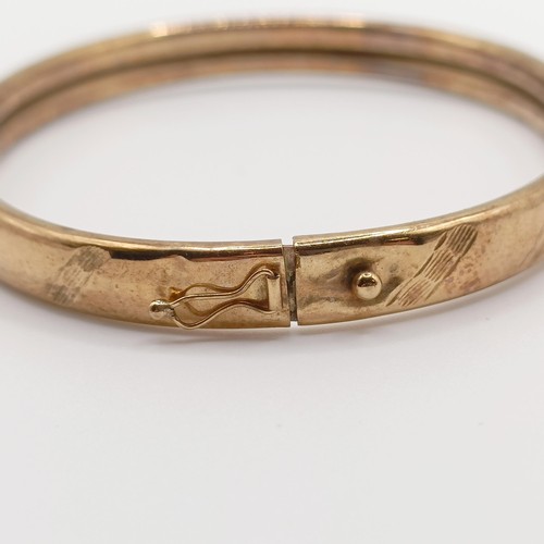 448 - A 9ct gold bangle, 6.2 g