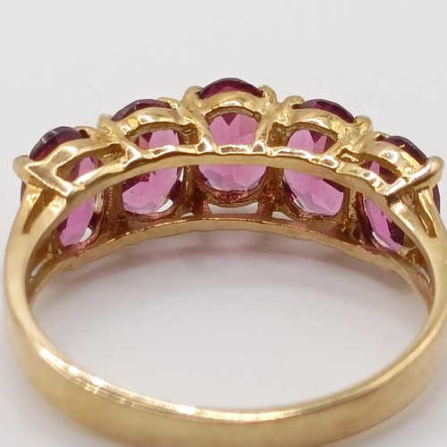 449 - A 9ct gold and blue stone cluster ring, ring size I, and a 9ct gold and pink stone ring, ring size R... 