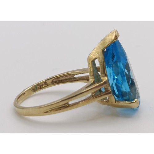 450 - A 9ct gold and blue stone dress ring, ring size G, an uncut garnet, and a 9ct gold and red stone rin... 