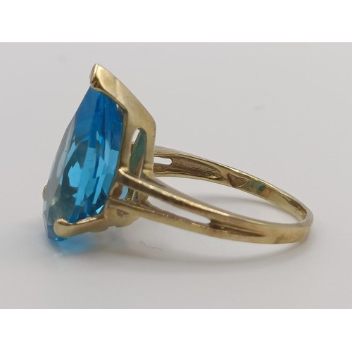 450 - A 9ct gold and blue stone dress ring, ring size G, an uncut garnet, and a 9ct gold and red stone rin... 