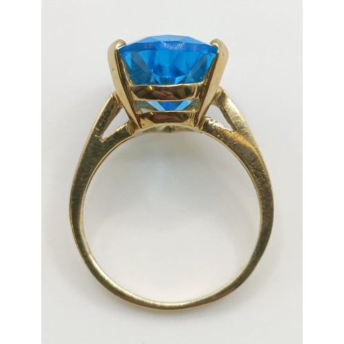 450 - A 9ct gold and blue stone dress ring, ring size G, an uncut garnet, and a 9ct gold and red stone rin... 