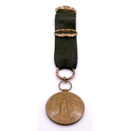 451 - A WWI Victory medal, engraved for his wife, on a silk and yellow metal cloth