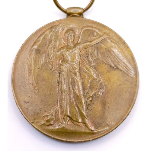 451 - A WWI Victory medal, engraved for his wife, on a silk and yellow metal cloth