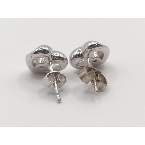 455 - A pair of 18ct white gold and diamond stud earrings