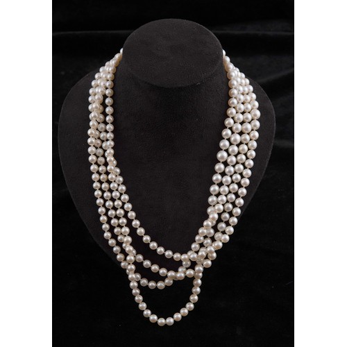 301 - A four strand cultured pearl necklace, with an impressive diamond clasp, the largest diamond approx.... 