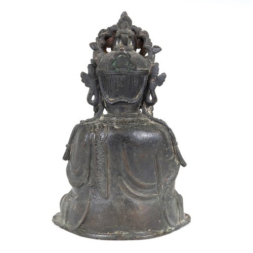 804 - A Chinese bronze Buddha, seated holding a scroll, 25 cm high