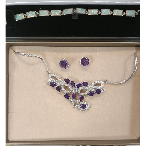 563 - A Dinny Hall purple and white stone necklace, and matching ear studs, boxed, and assorted other cost... 