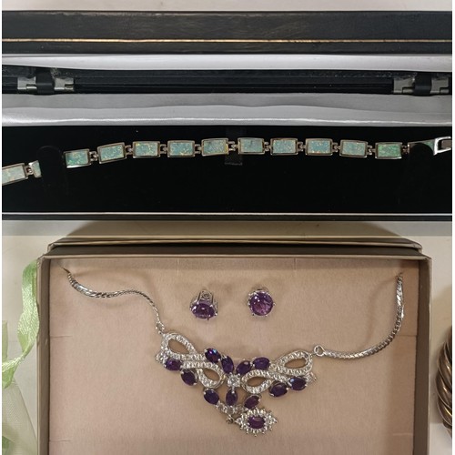 563 - A Dinny Hall purple and white stone necklace, and matching ear studs, boxed, and assorted other cost... 