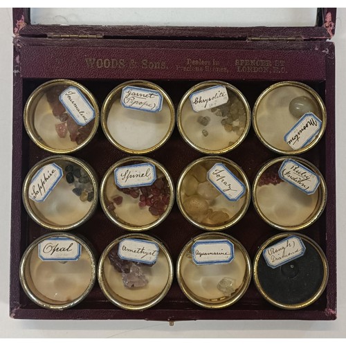 567 - An unusual early 20th century cased set of uncut gems, retail mark for Woods & Son