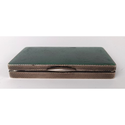 74 - A silver and green enamel snuff box, 8 cm wide