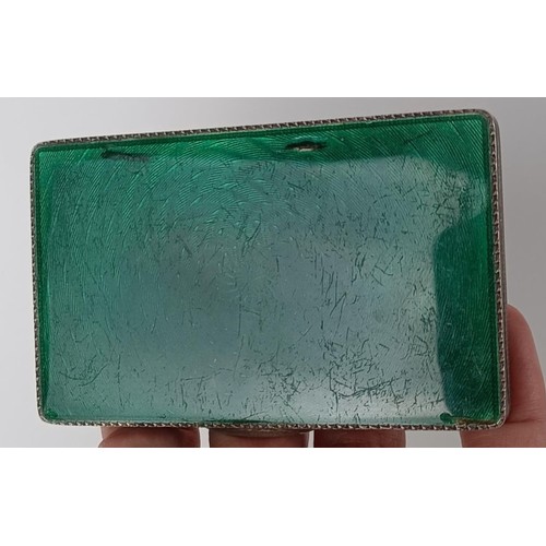 74 - A silver and green enamel snuff box, 8 cm wide