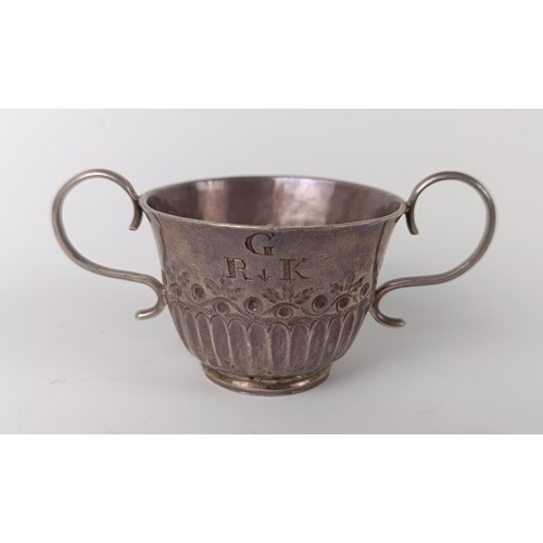 72 - An 18th century silver toy porringer, initialed, with embossed and fluted decoration, makers mark on... 