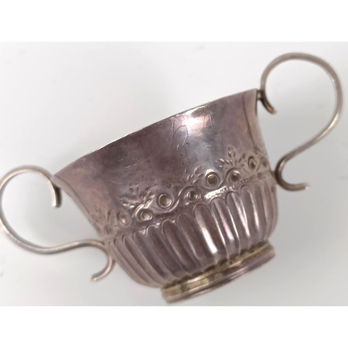 72 - An 18th century silver toy porringer, initialed, with embossed and fluted decoration, makers mark on... 