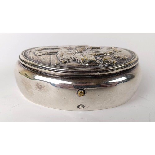 133 - A Dutch silver coloured metal oval tobacco box, the lid decorated a tavern scene, 10 cm wide