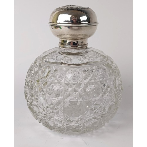 138 - A Edwardian VII silver and cut glass scent bottle, the lid embossed cherubs,  Birmingham 1906, ... 