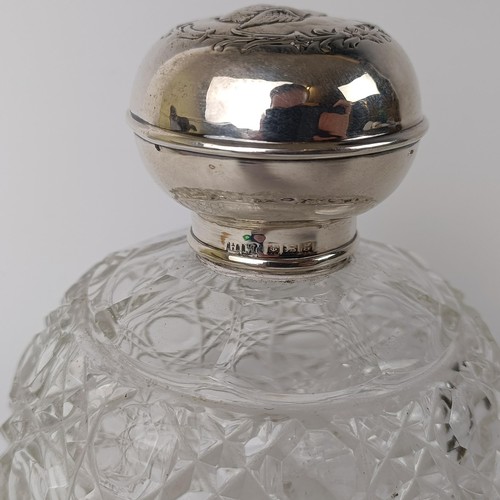 138 - A Edwardian VII silver and cut glass scent bottle, the lid embossed cherubs,  Birmingham 1906, ... 