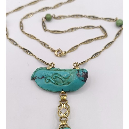 367 - A 14ct gold and carved turquoise bird pendant, on a chain