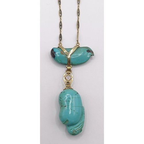 367 - A 14ct gold and carved turquoise bird pendant, on a chain