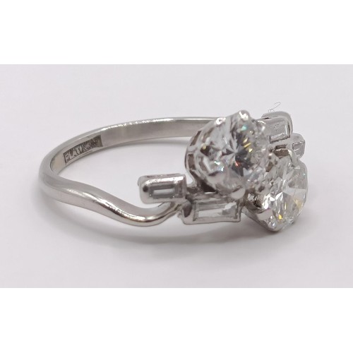 377 - An Art Deco platinum and diamond crossover ring, ring size K