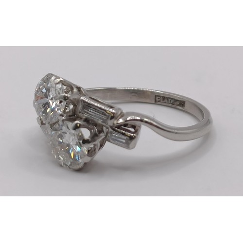 377 - An Art Deco platinum and diamond crossover ring, ring size K