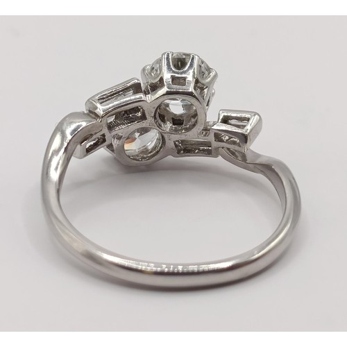 377 - An Art Deco platinum and diamond crossover ring, ring size K