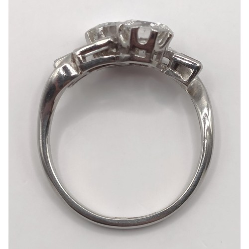 377 - An Art Deco platinum and diamond crossover ring, ring size K