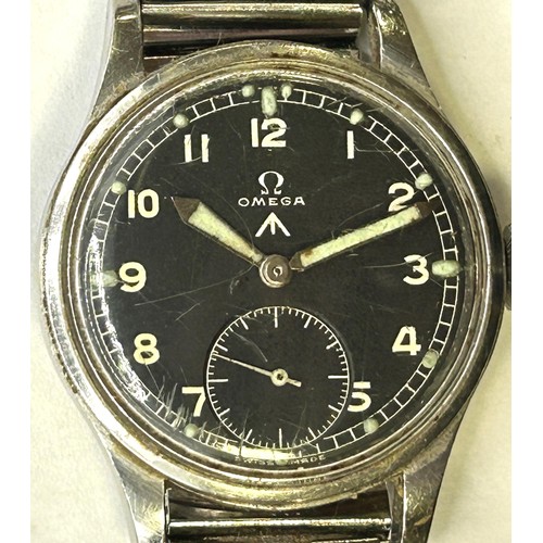 586 - A gentleman's stainless steel Omega military issue wristwatch, the black dial with Arabic numerals a... 