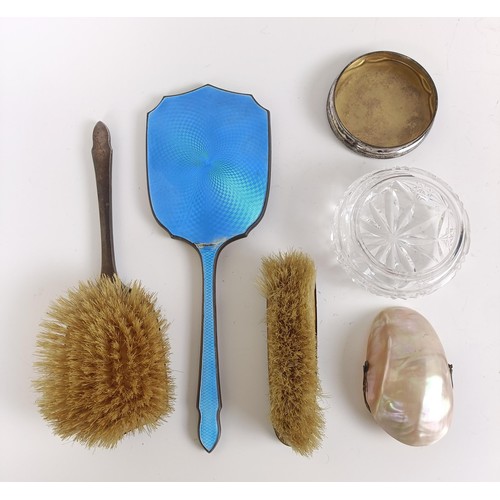 160 - A George V silver and blue enamel hand mirror, two matching brushes, a cut glass vase with silver li... 