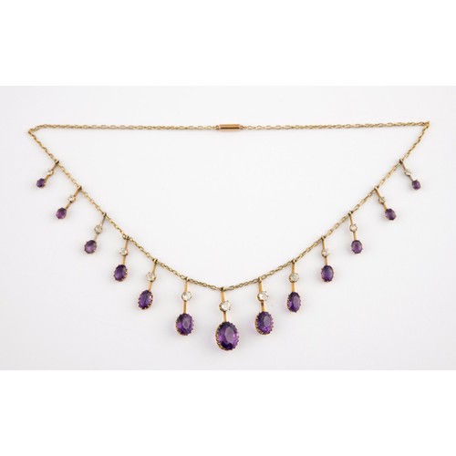 461 - A yellow coloured metal and amethyst fringe necklace