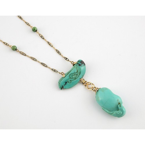 367 - A 14ct gold and carved turquoise bird pendant, on a chain